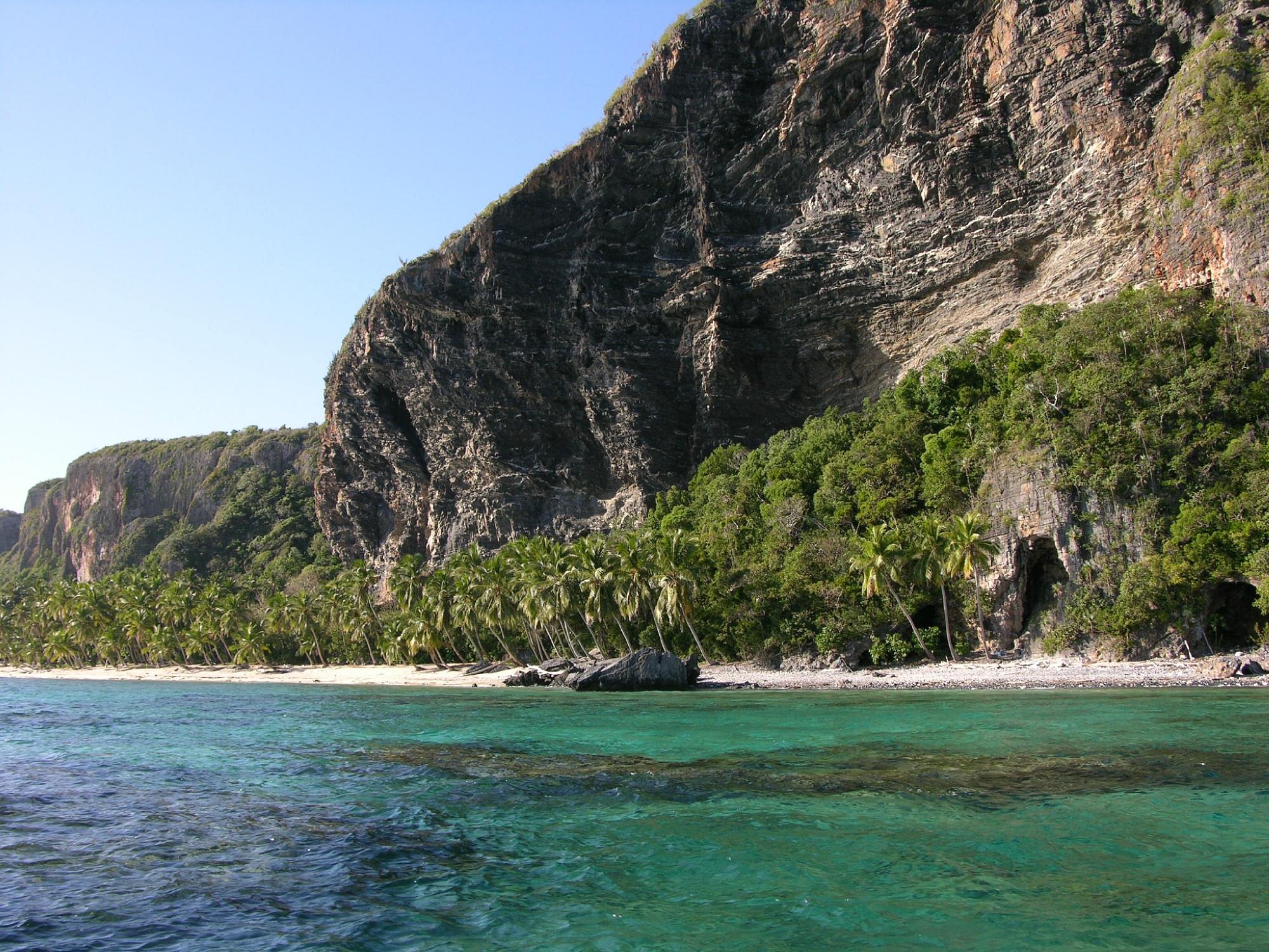 Aerial view of Playa Frontón's pristine beach with crystal clear turquoise waters and white sand
